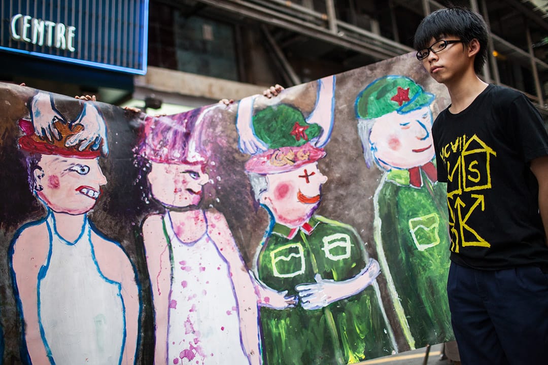 2012年，学民思潮于旺角行人专用区举行反国民教育洗脑活动。摄:林亦非/端传媒