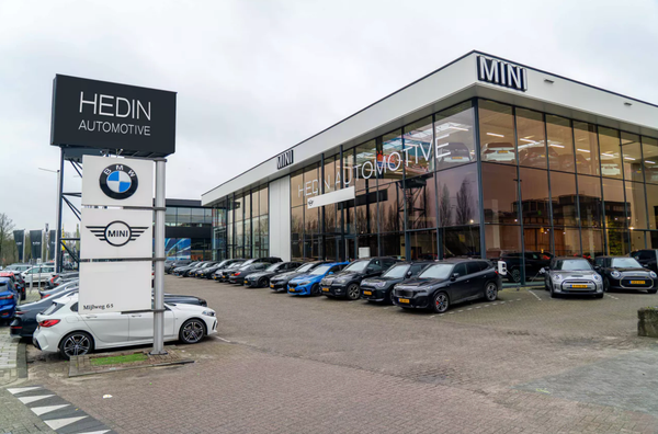 Hedin halveert halfjaarverlies