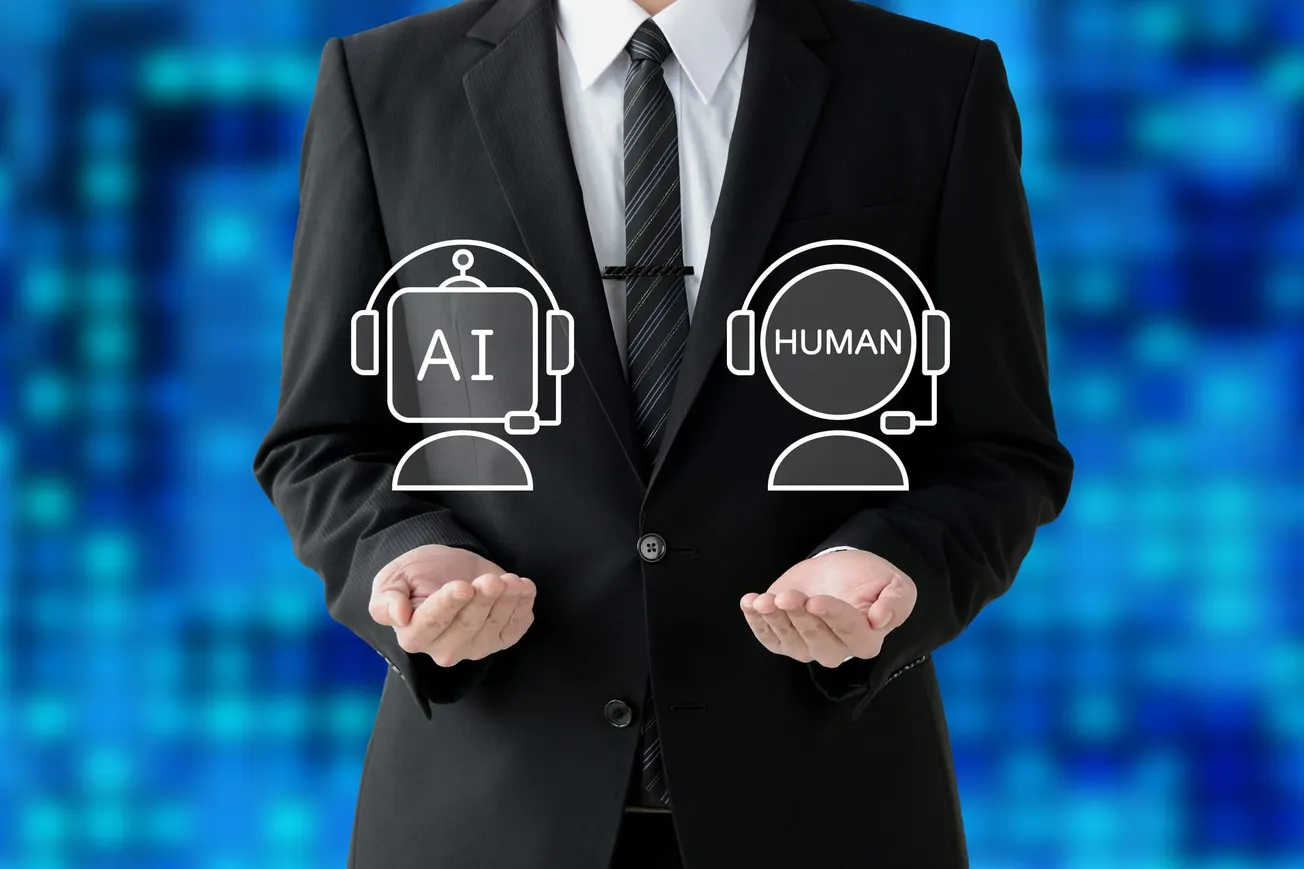 A person in a suit holding icons of a robot labeled "AI" and a person labeled "Human," with a blue digital background, conveying AI vs. human interaction.