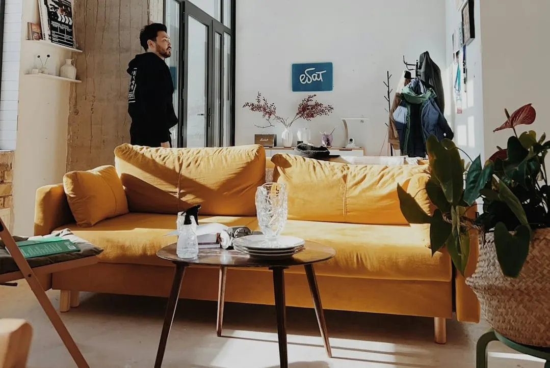 Customers explore sleek, modern furniture displays within a spacious Article brand store, showcasing an evolving omnichannel retail experience.