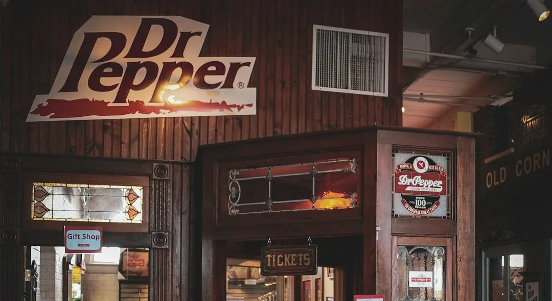 A smartphone displays a short, engaging video featuring a Dr Pepper Creamy Coconut can, illustrating modern digital marketing and omnichannel consumer connection.