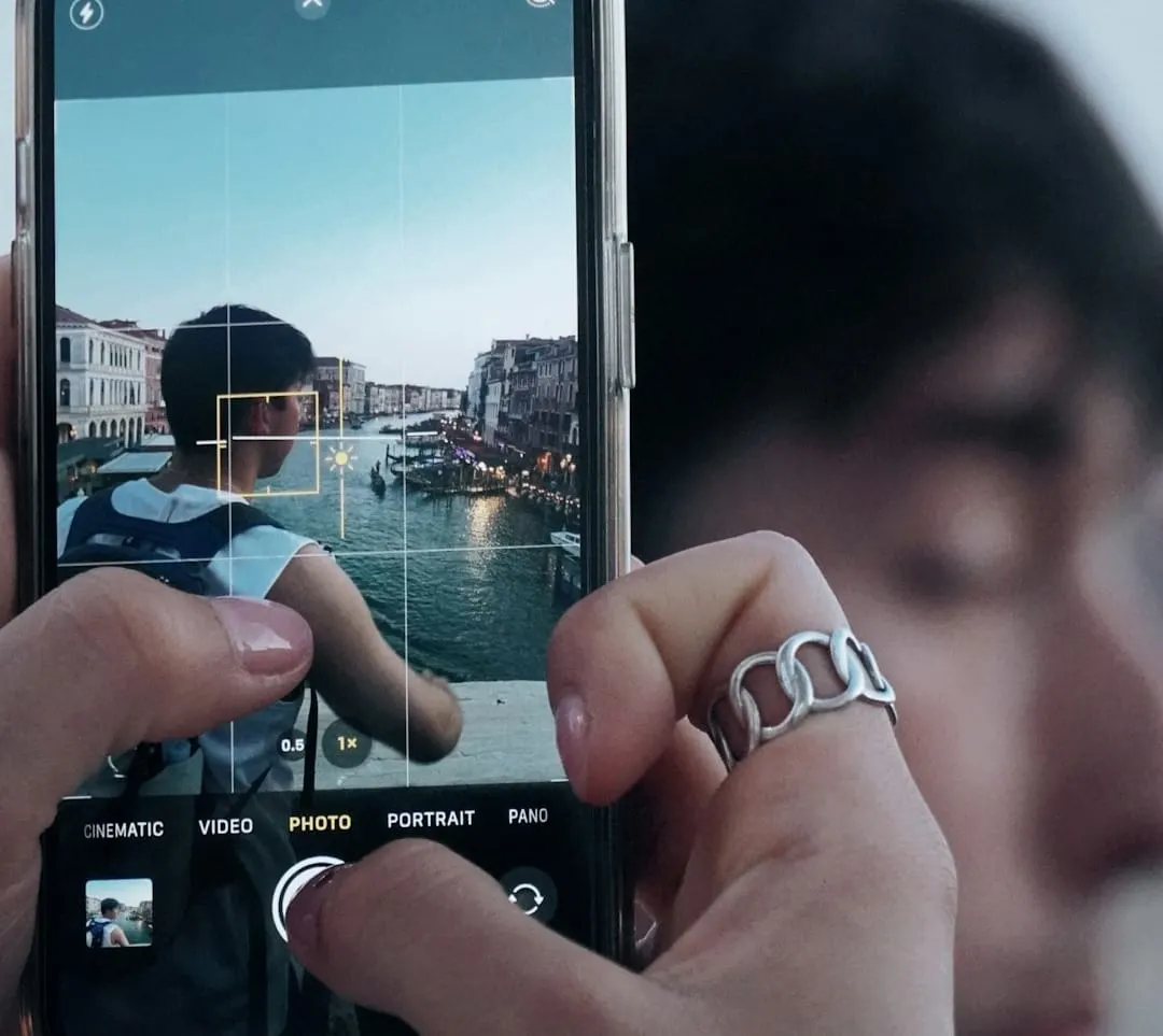 A user books a trip on a mobile app while a digital creator films content, illustrating modern omnichannel travel marketing strategies.
