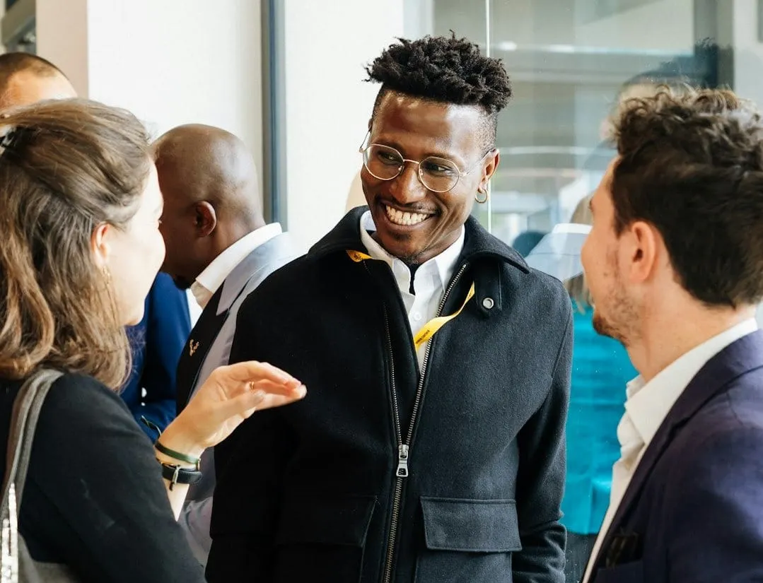 Industry leaders and procurement executives network at a technology conference, discussing innovative supply chain strategies and AI integration.