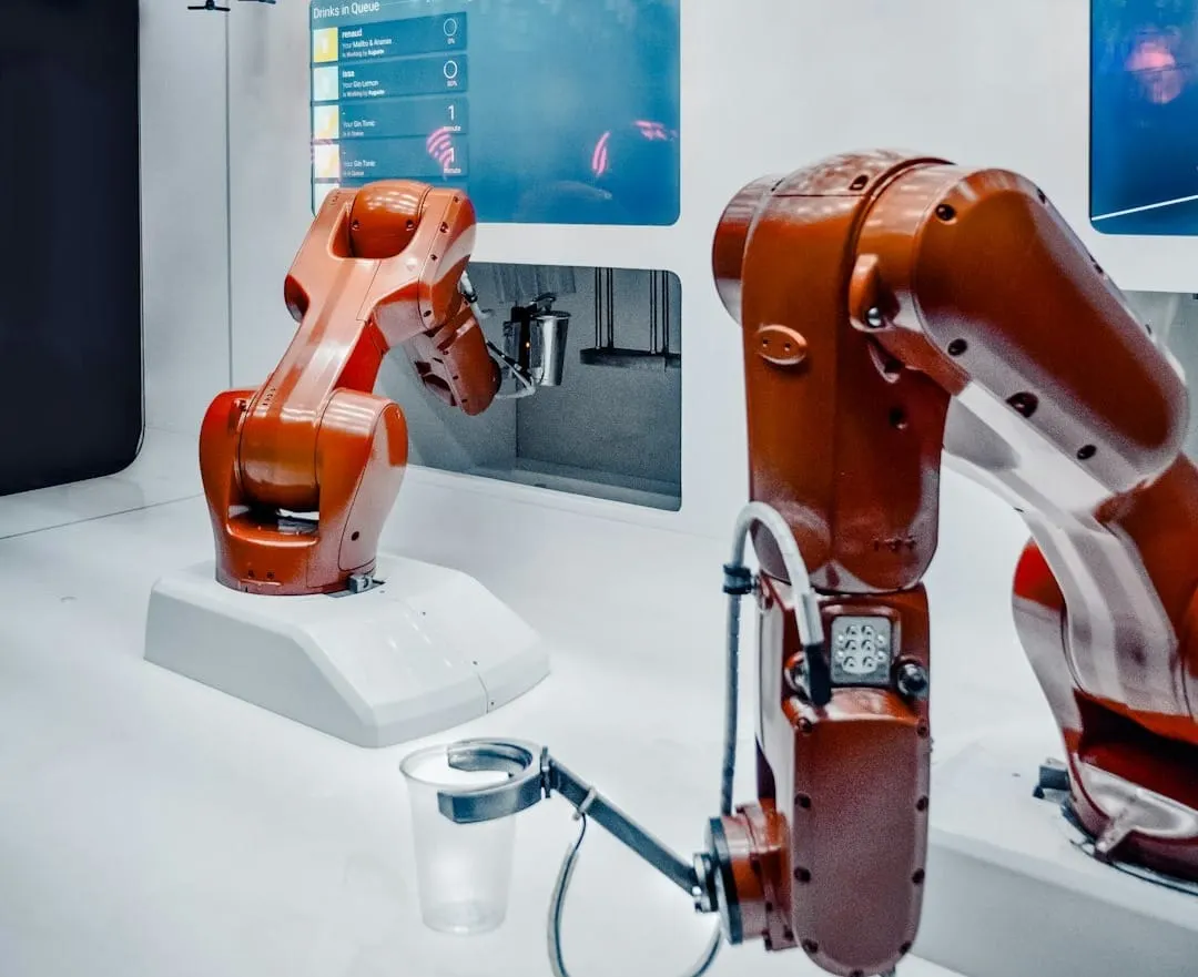 Automated robotic systems efficiently manage inventory and package flow within a sophisticated, high-tech distribution center, reflecting advanced supply chain technology.