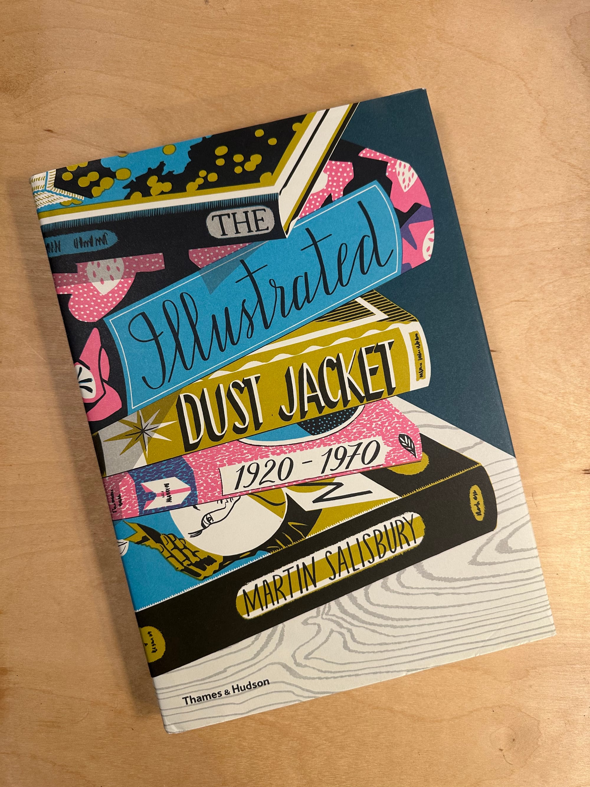 illustrated book cover on wood table