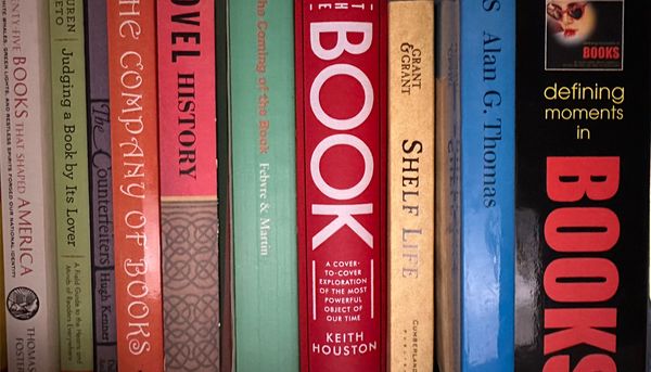 books about books on the shelf; all spine out