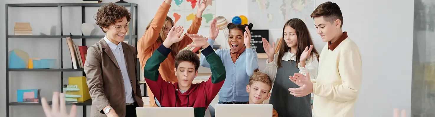 Teens celebrating financial success, learning smart money habits for ADHD, autism, and dyslexia.