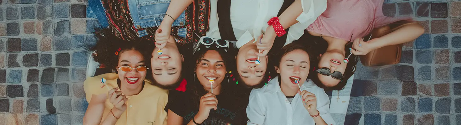 A group of neurodivergent teens relaxing together, showing that financial independence starts with confidence.