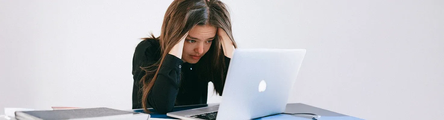 A young woman struggling with online job searches.
