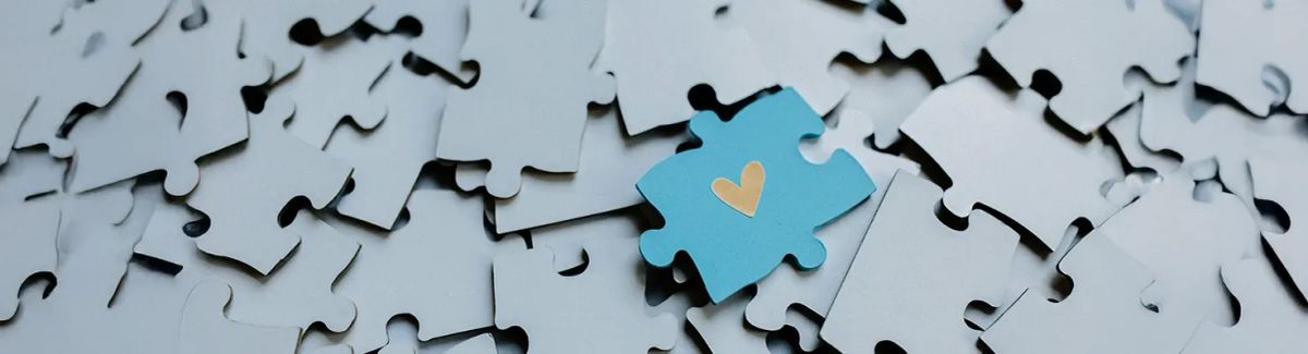 A heart on a autism inspired puzzle piece.