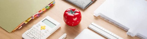 A Pomodoro timer sitting on a desk tracking time for time blindness.
