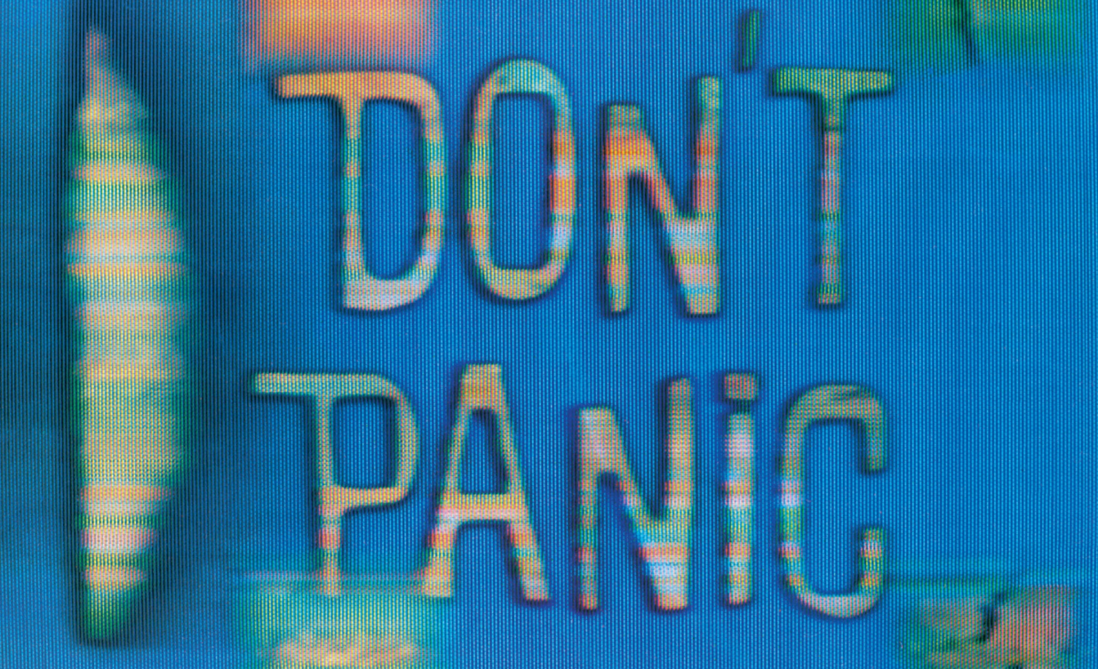 Don't panic - written in large friendly letters on a blue background