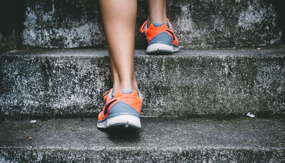 Closeup of feet climbing stairs