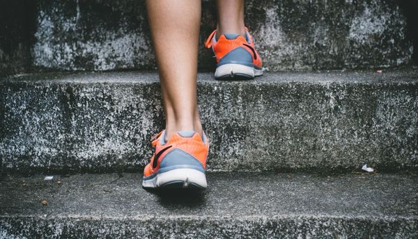 Closeup of feet climbing stairs