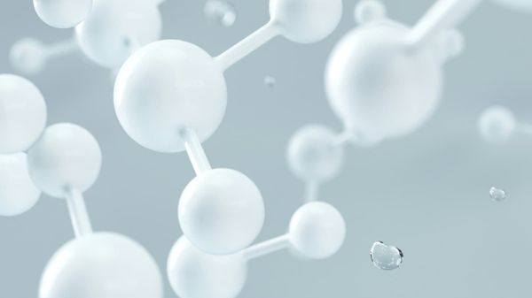 White spheres with rods connecting them on a grey background.