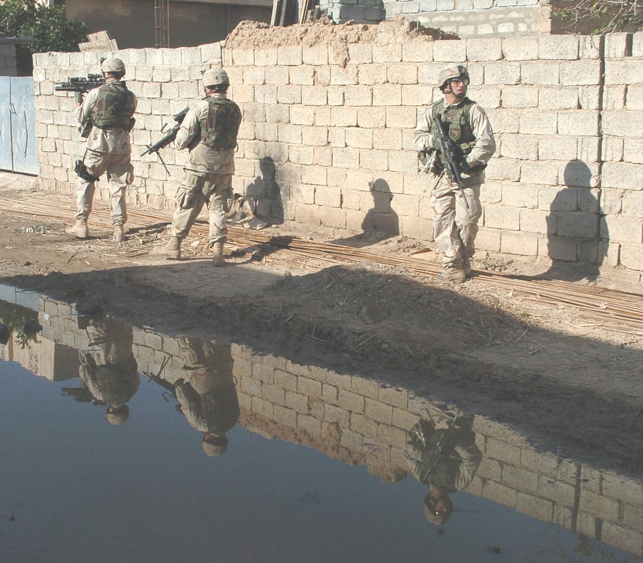 U.S. soldiers patrol Hawija, Iraq, in November 2004. The wars in Afghanistan and Iraq became part of a broader fiscal reversal after 2001, alongside recession and tax cuts, as federal deficits returned and debt began rising again. Source: DVIDS Hub