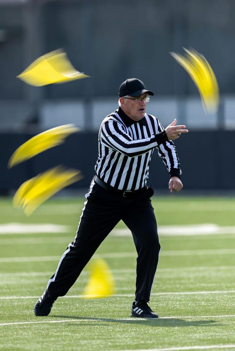 When did football referees start using the penalty flag?