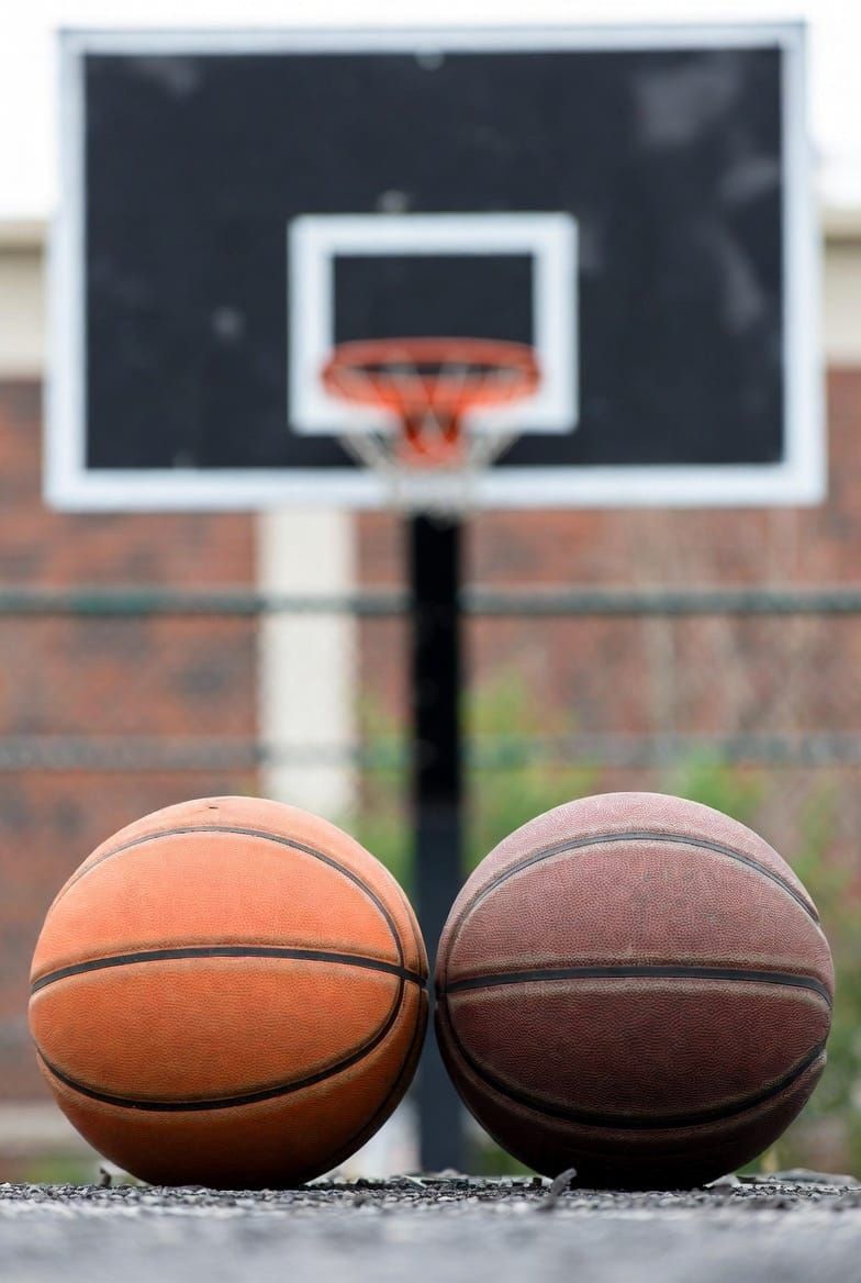 Why are the regulation basketball and the regulation hoop that size?