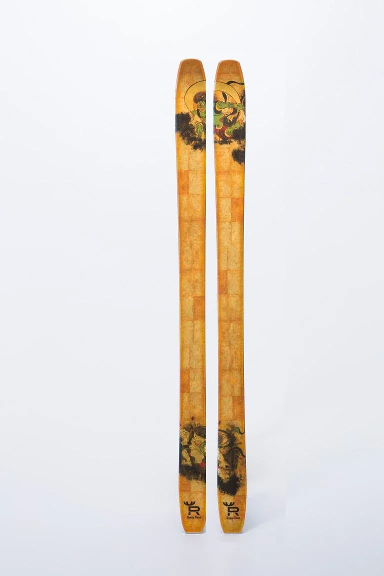 Ornate skis with a Japaense motif and gold leaf