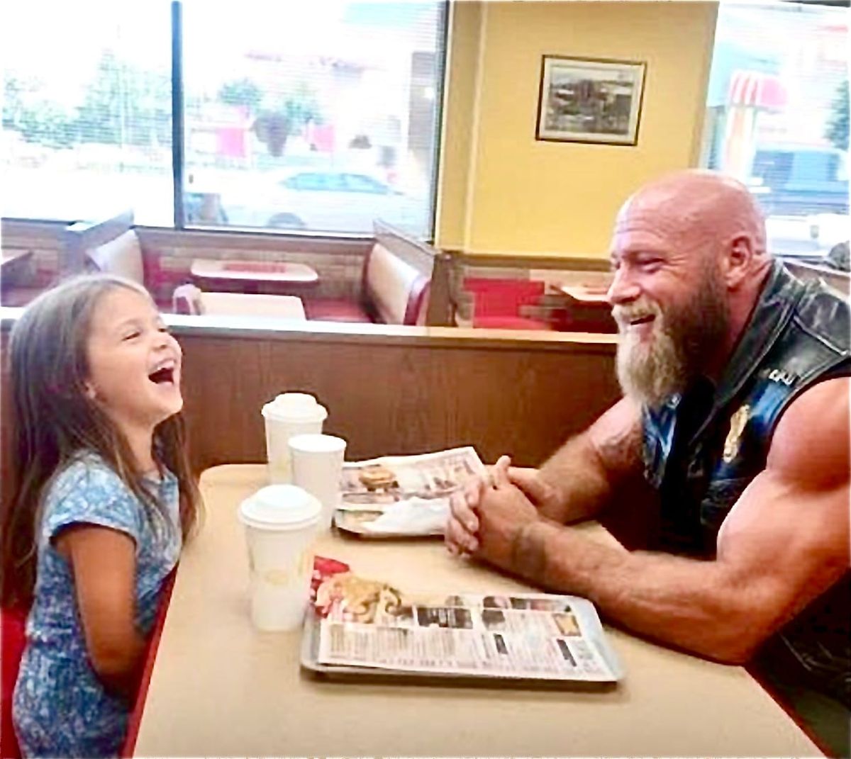 Every Saturday, this terrifying biker meets a little girl at McDonald's.