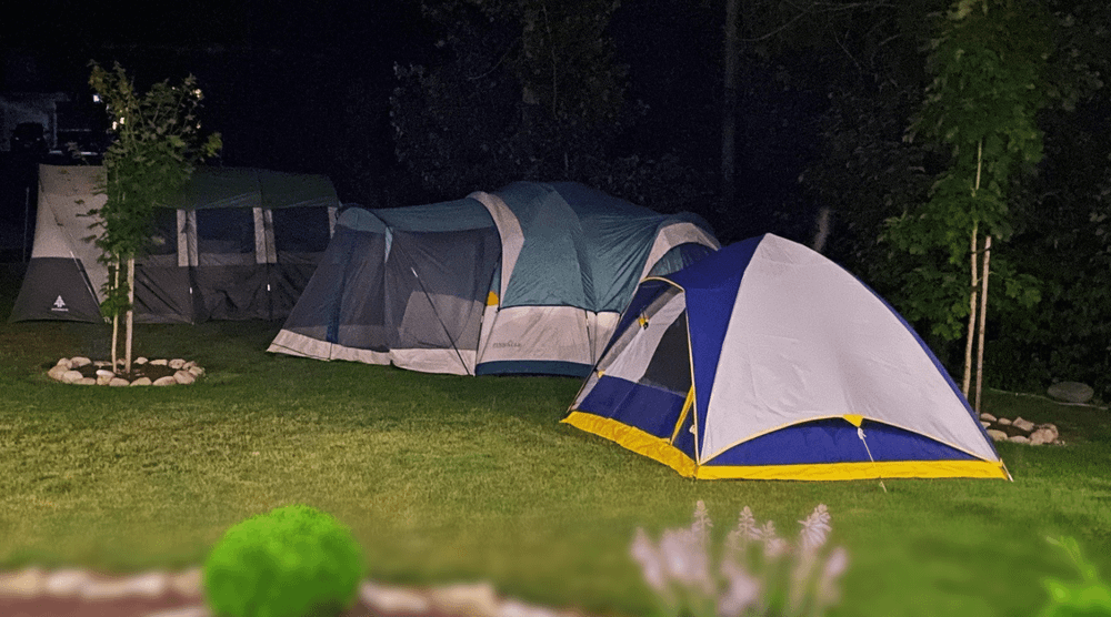 Instant tents in a front yard set up for camping overnight