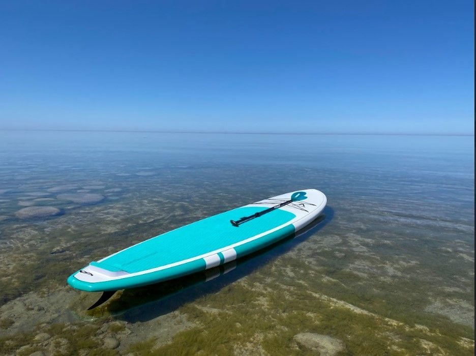Adventure All Rounder Paddle board by Global Surf Industries floating in Lake Huron