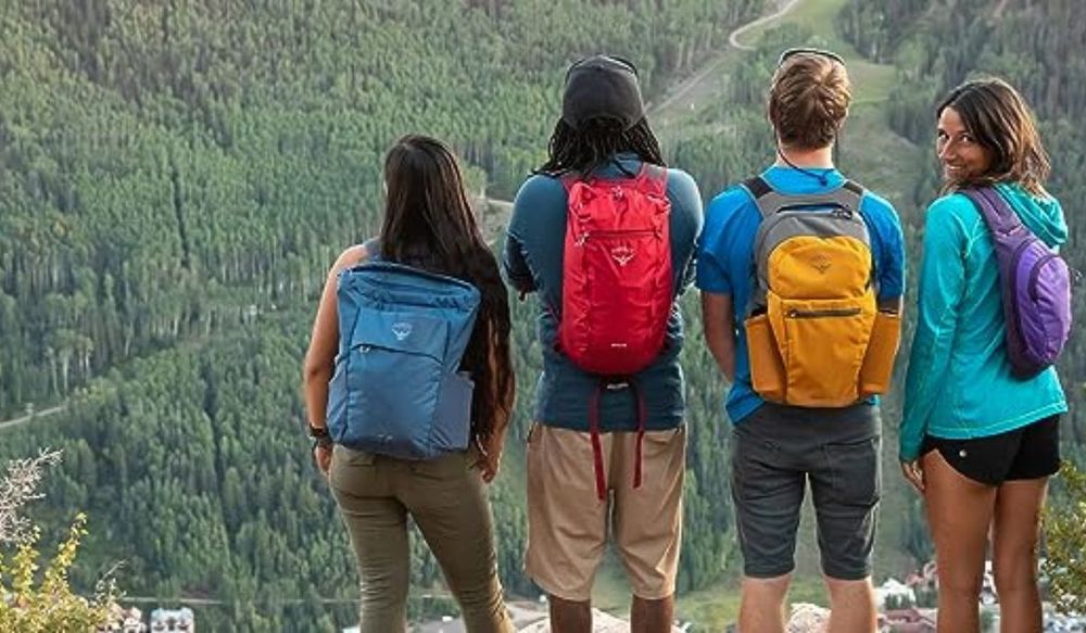 Shop Backpacks on Sale | Osprey Backpacks on four student on top of a mountain.