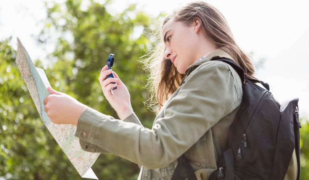 A woman mastering the art of navigation with a compass