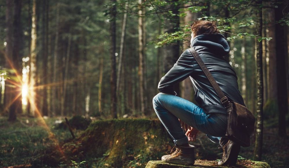 Modern-Day Explorer in the woods finding his way