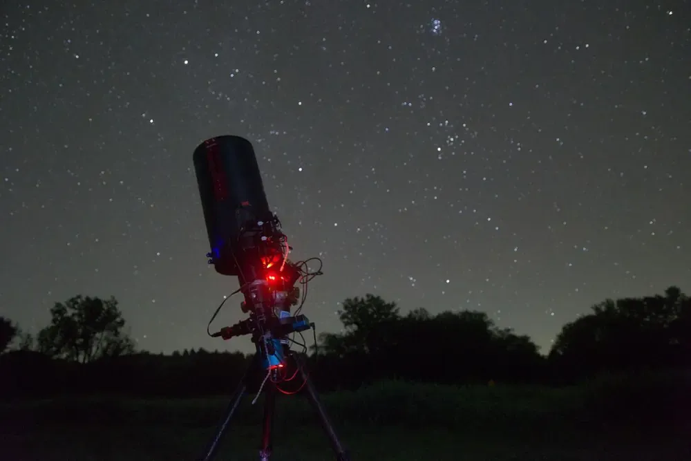 Telescope imaging rig on an equatorial mount ready for autoguiding