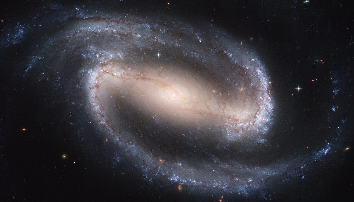 Barred spiral galaxy NGC 1300 with a bar of stars across its core