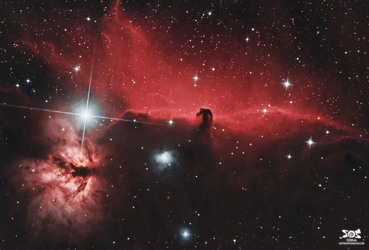 Dark nebula — the Horsehead silhouetted against glowing hydrogen gas
