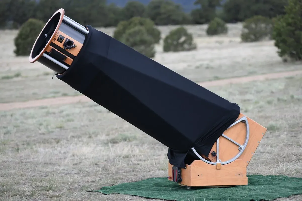 A large 20-inch Obsession Dobsonian telescope on its alt-azimuth rocker-box mount
