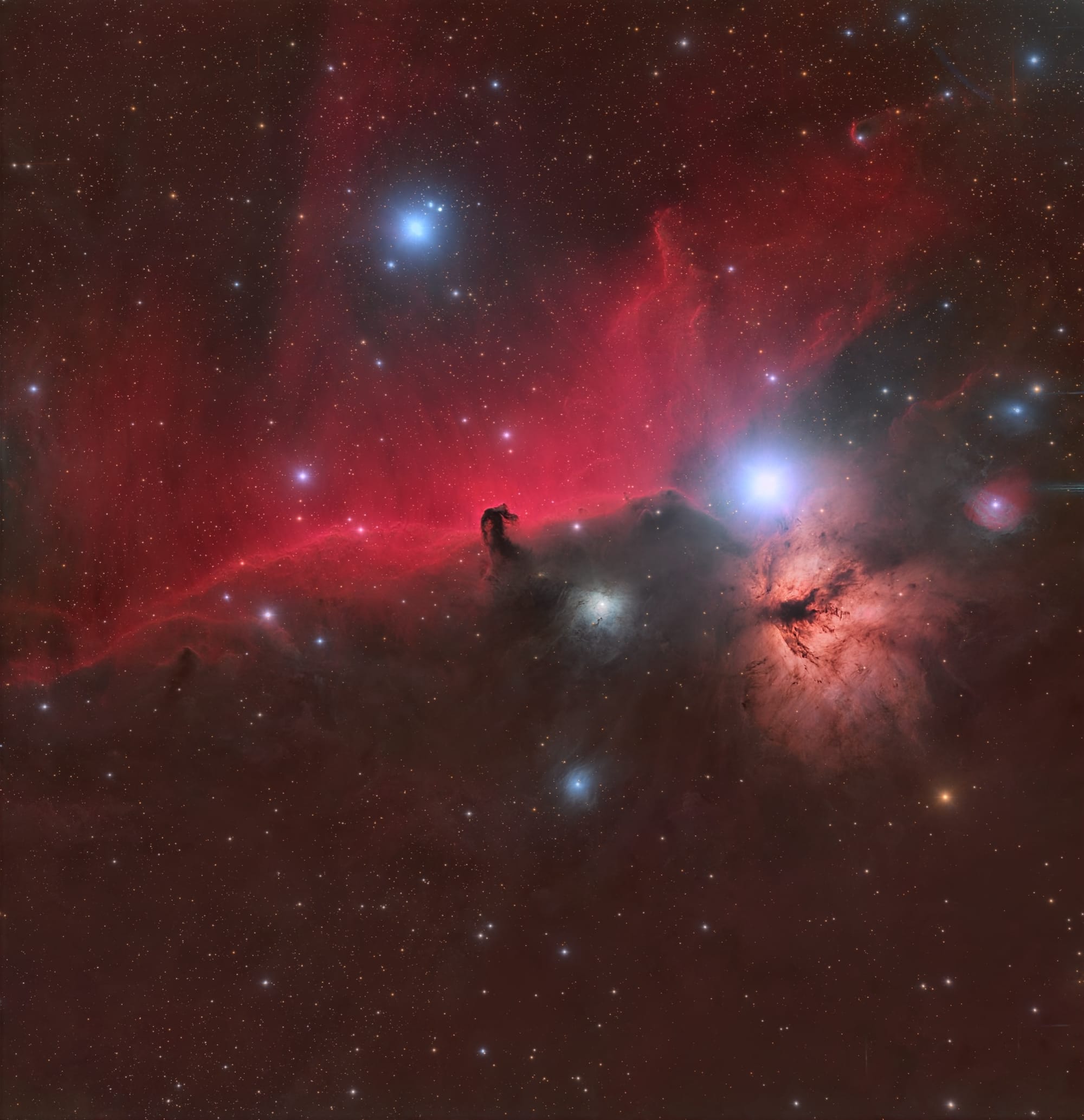 The Horsehead Nebula (Barnard 33) silhouetted against the red glow of IC 434, with the Flame Nebula and Alnitak to its left — our own capture