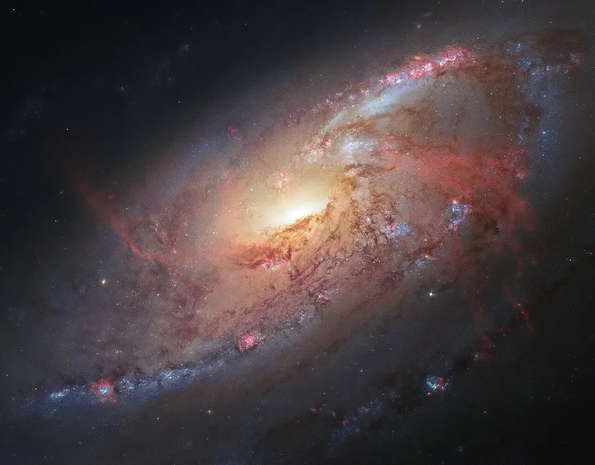 Messier 106 spiral galaxy in Canes Venatici imaged by Hubble