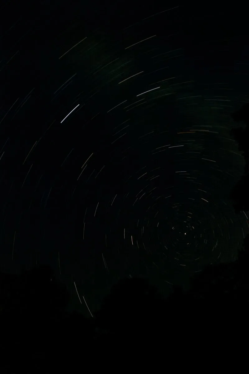 Long-exposure photograph of star trails circling the north celestial pole