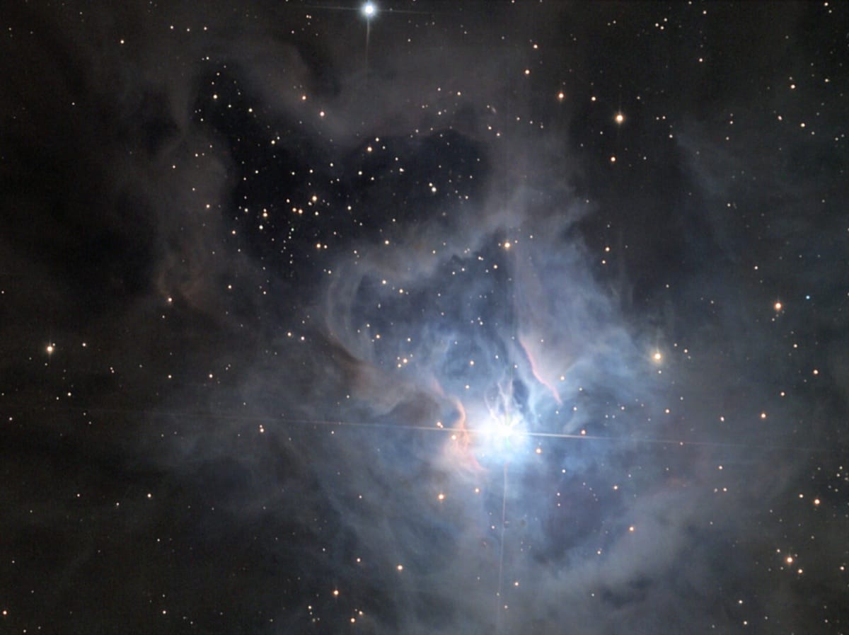 The Iris Nebula NGC 7023, a blue reflection nebula surrounded by dark dust lanes in Cepheus