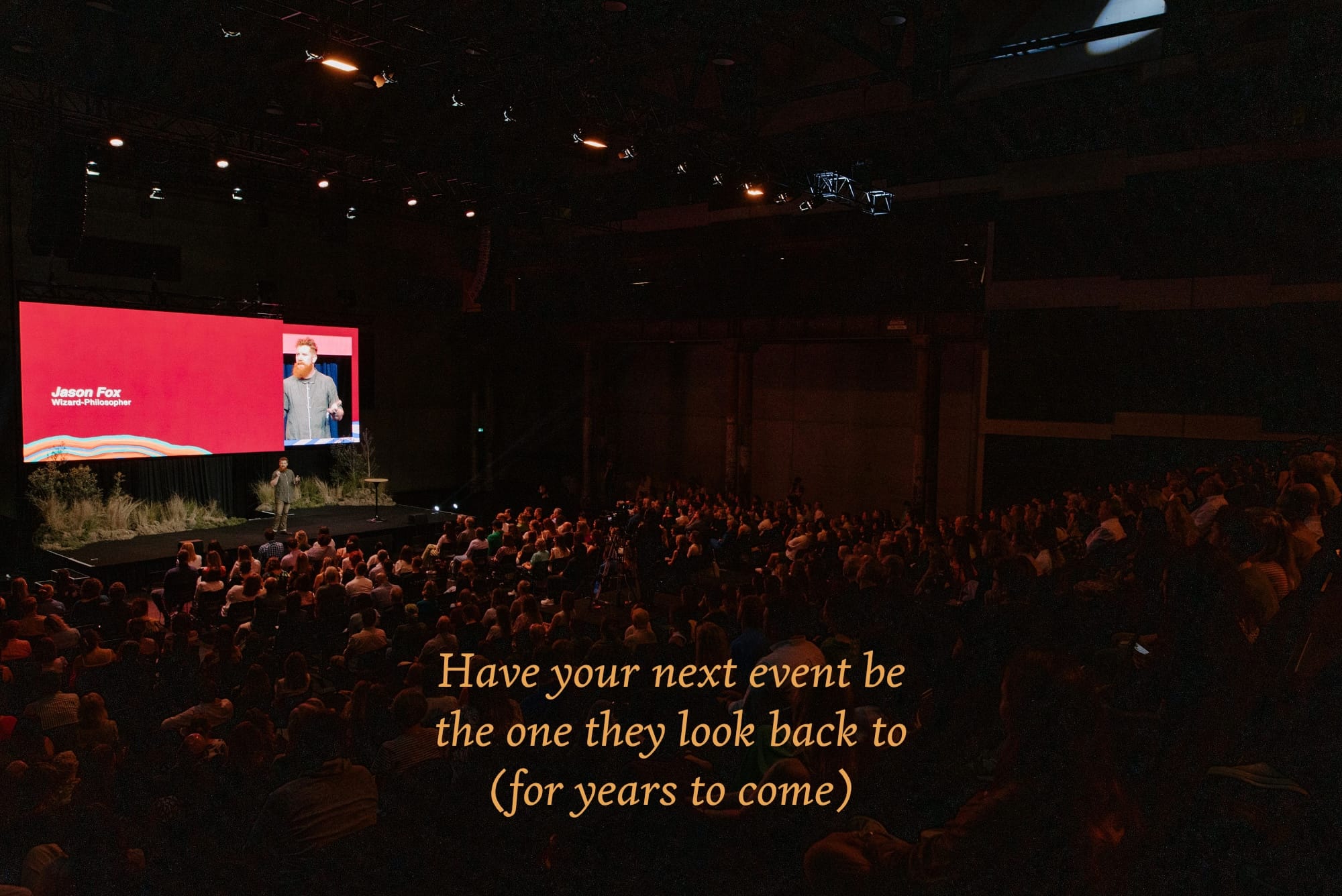 Jason Fox speaking to an audience on a stage