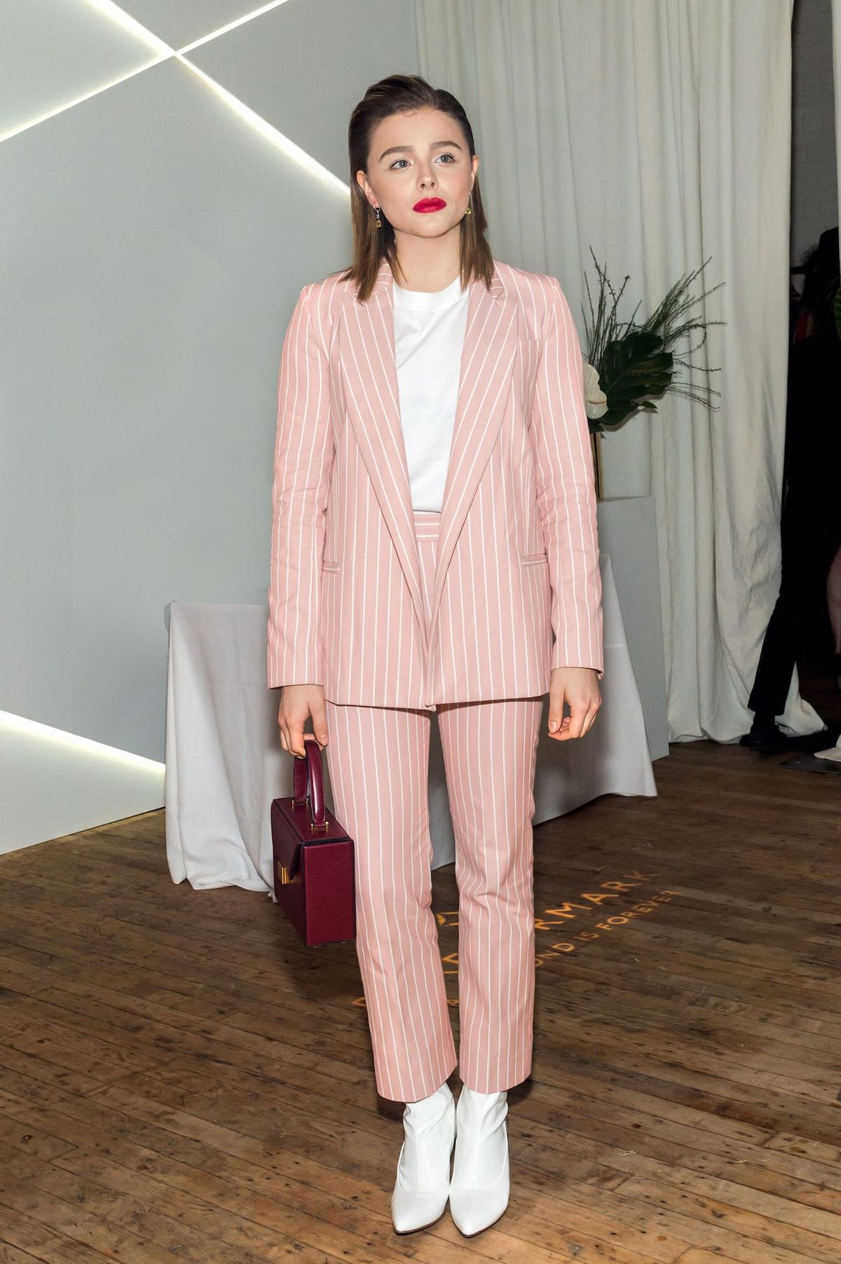 Chloe Grace Moretz Suits Up and Sucks Up