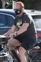 Arnold Schwarzenegger Has Spent The Pandemic Biking Around In Arnold T-Shirts