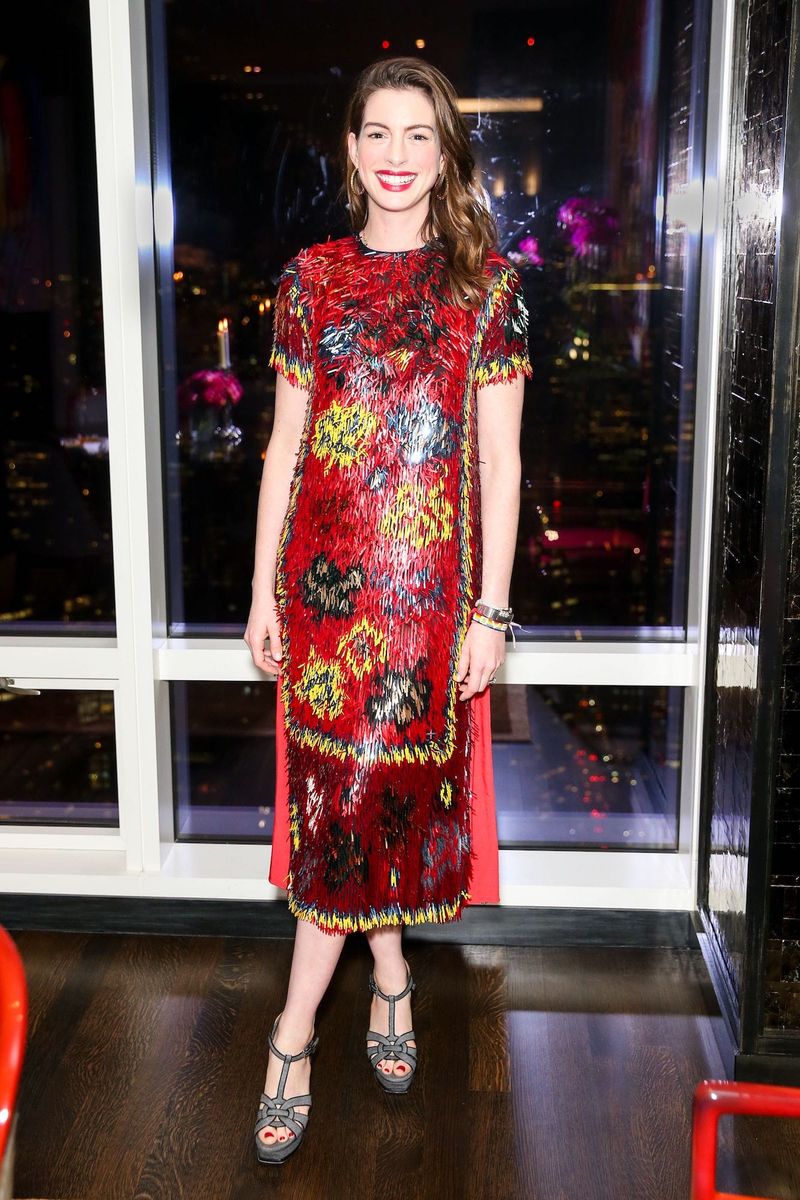 Anne Hathaway Wears a Festive Valentino Throw Rug