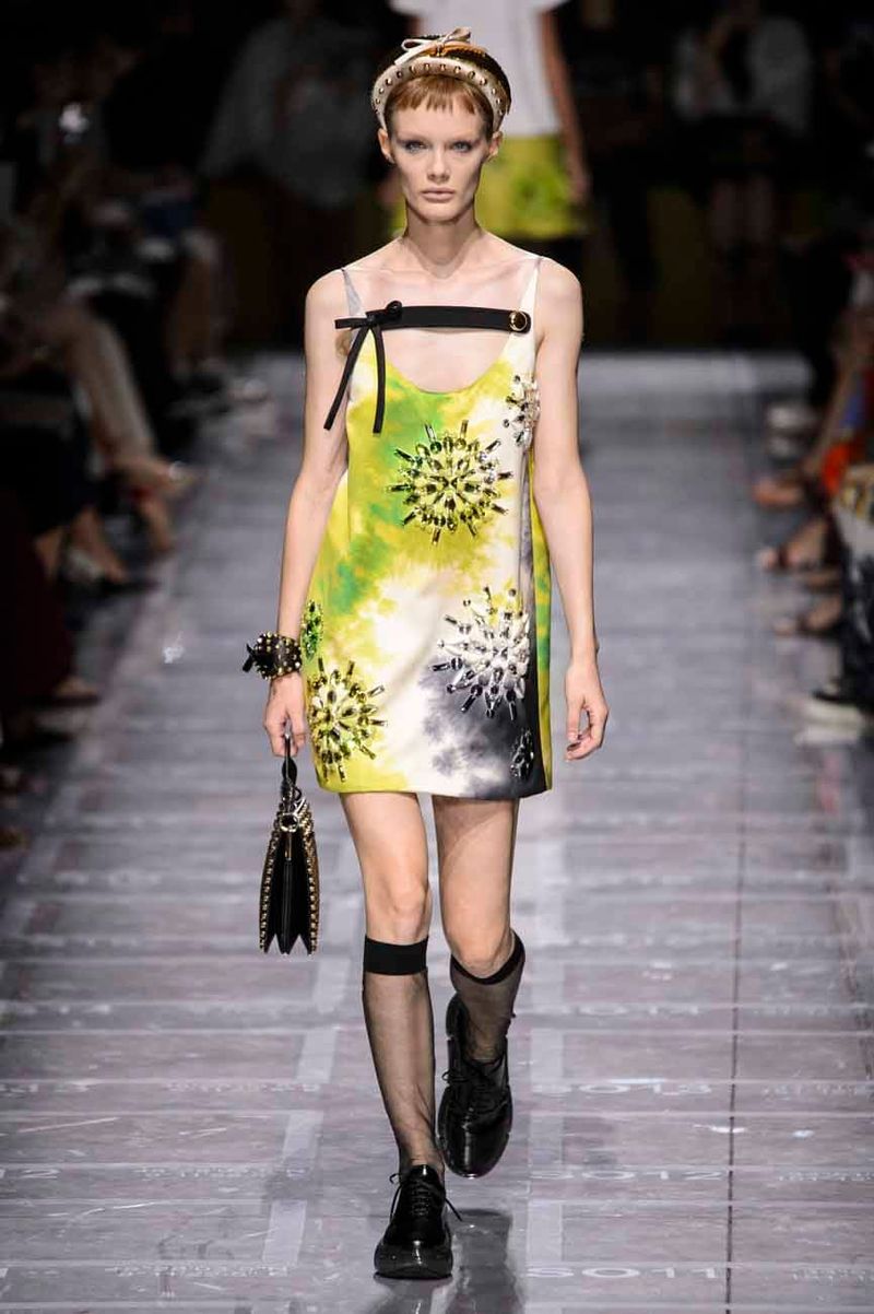 Prada Sent Lots of Hats (and Boobs) Down The Runway
