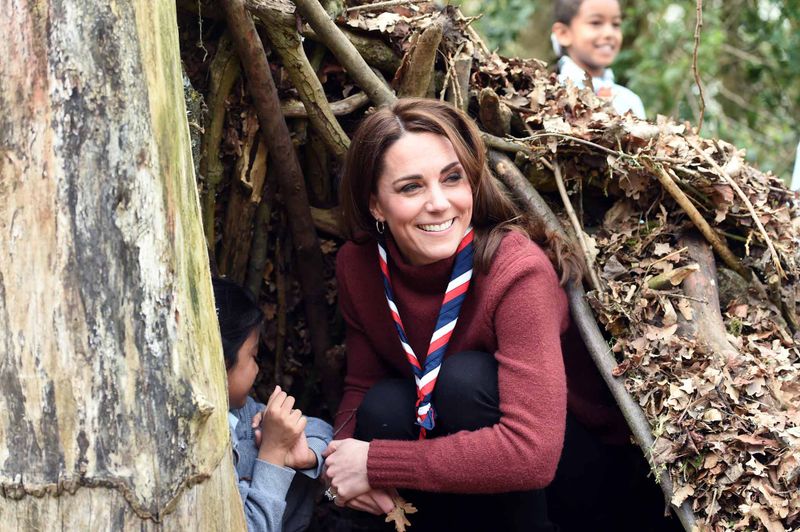 Kate Climbs Into Piles of Leaves With Children