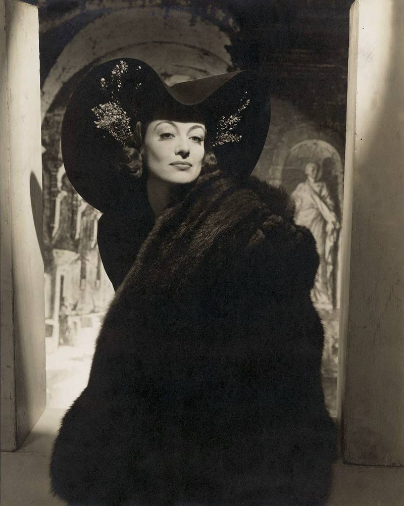 On This Day in 1938, Joan Crawford Wore a Giant Hat and a Fur...