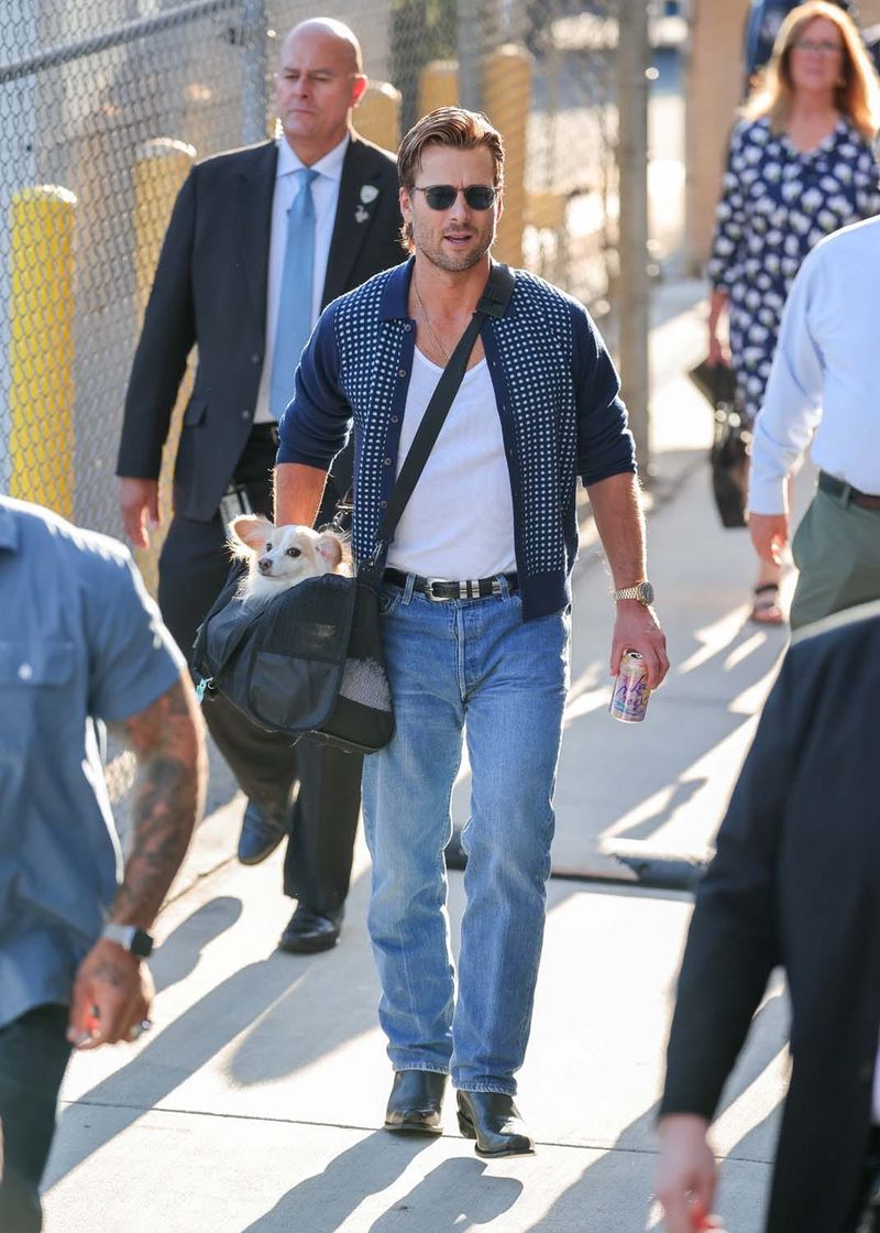 Glen Powell Looks Casually Good Carrying His Dog Around
