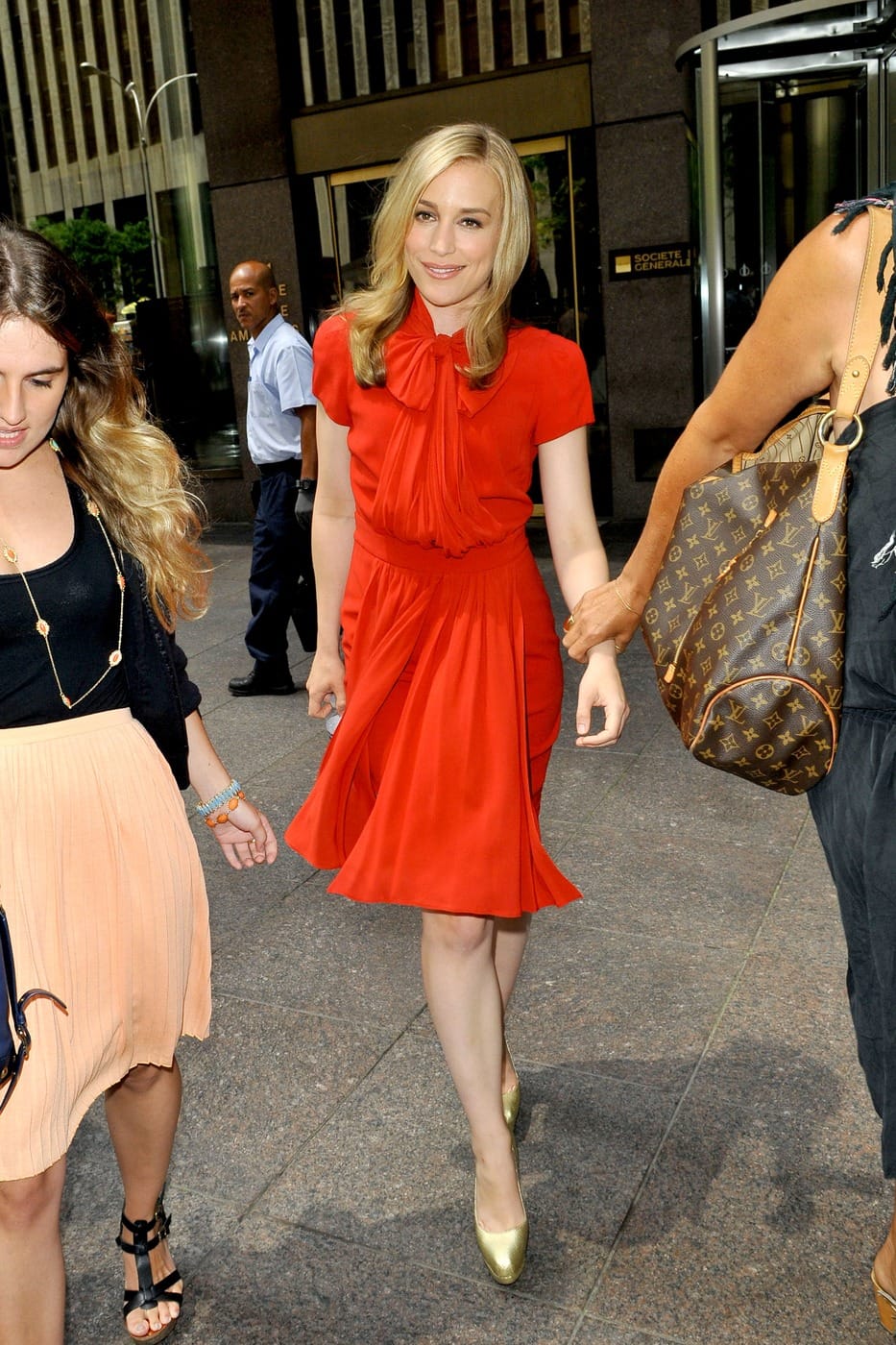 "Covert Affairs" star Piper Perabo leaves Sirius Radio in NYC wearing a festive red dress and gold platform heels