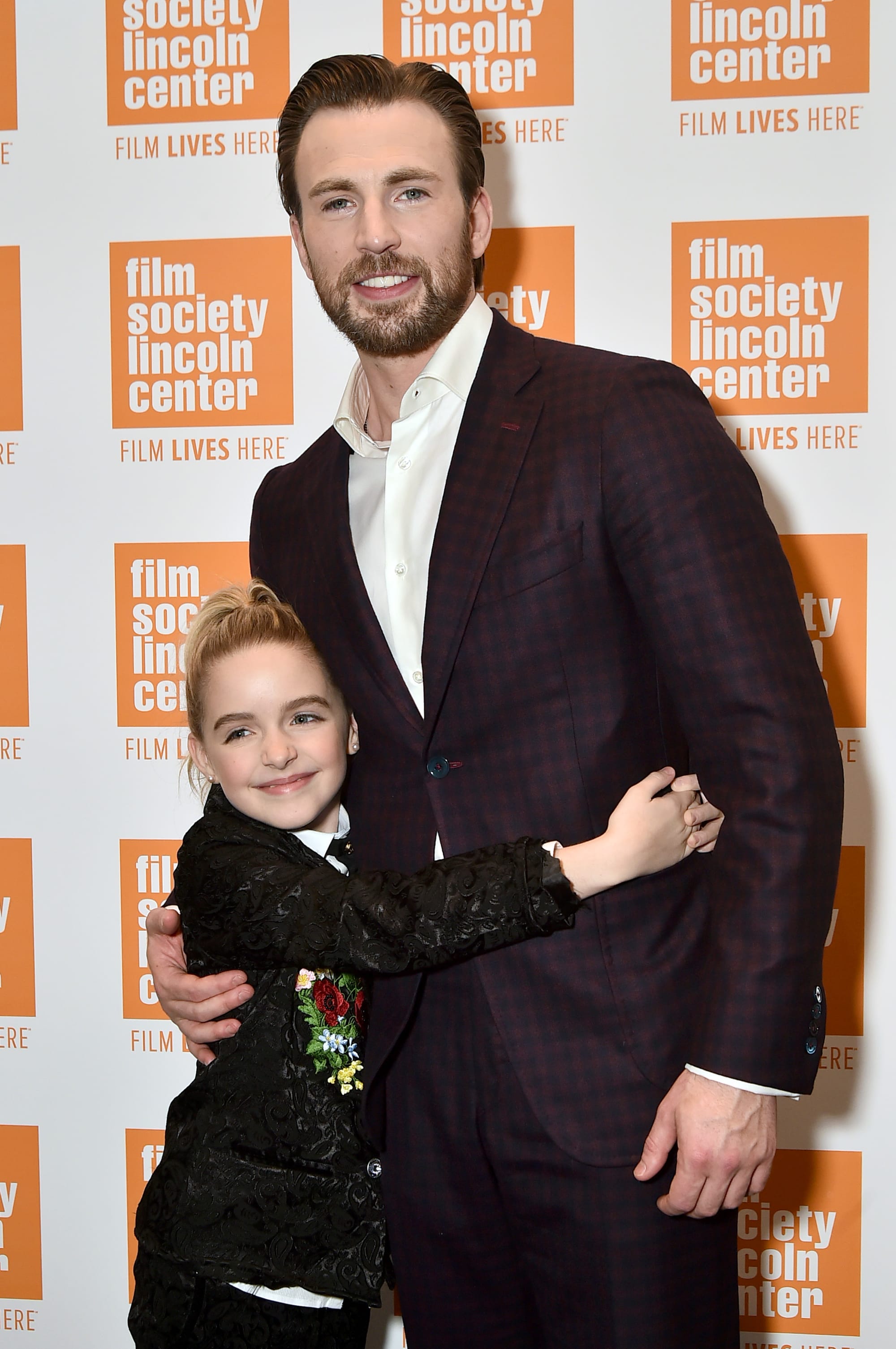 Chris Evans Hugs A Child