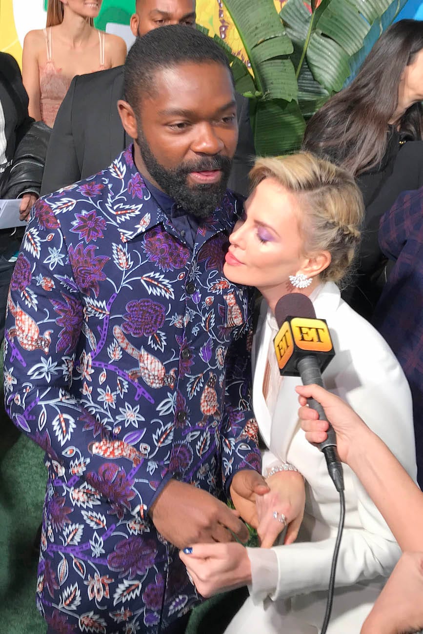 Charlize Theron, Channeling Us All, Tenderly Clutches David Oyelowo