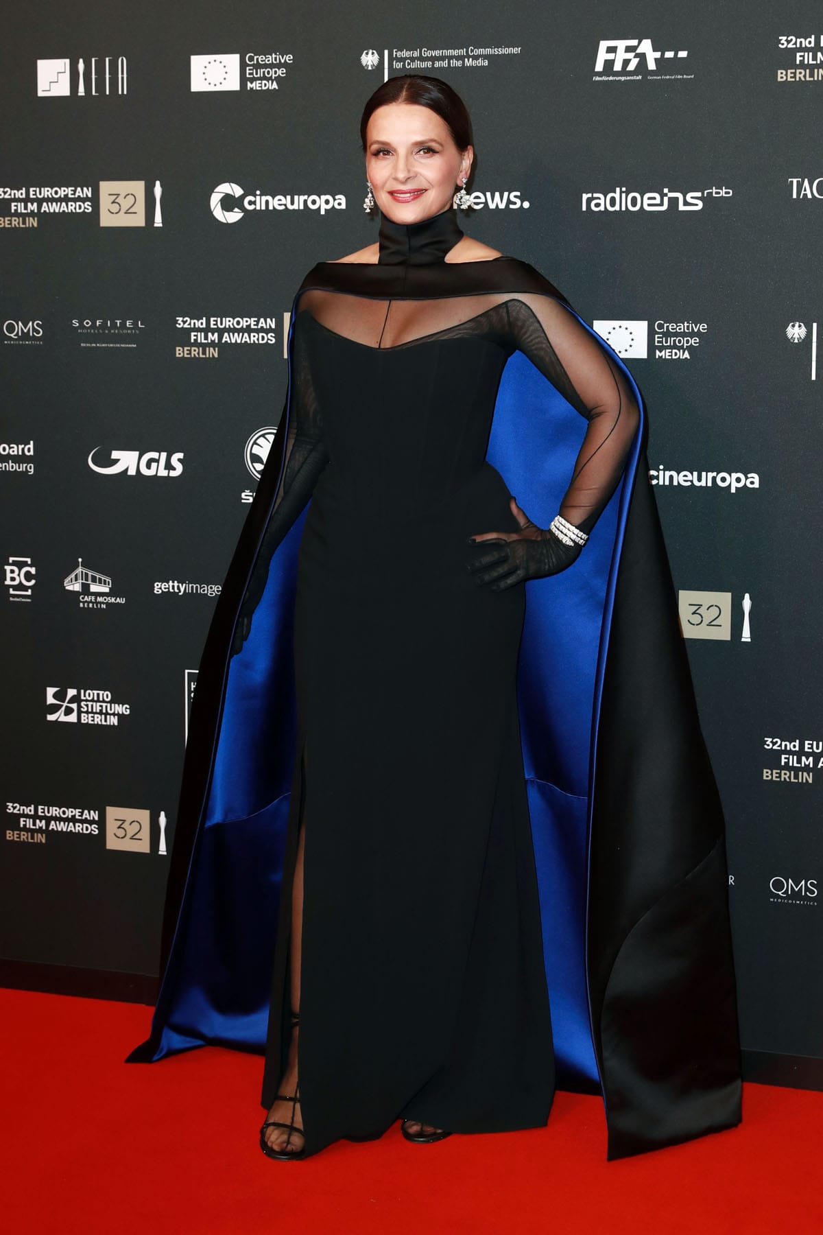 Juliette Binoche Brings Drama, and a Cape