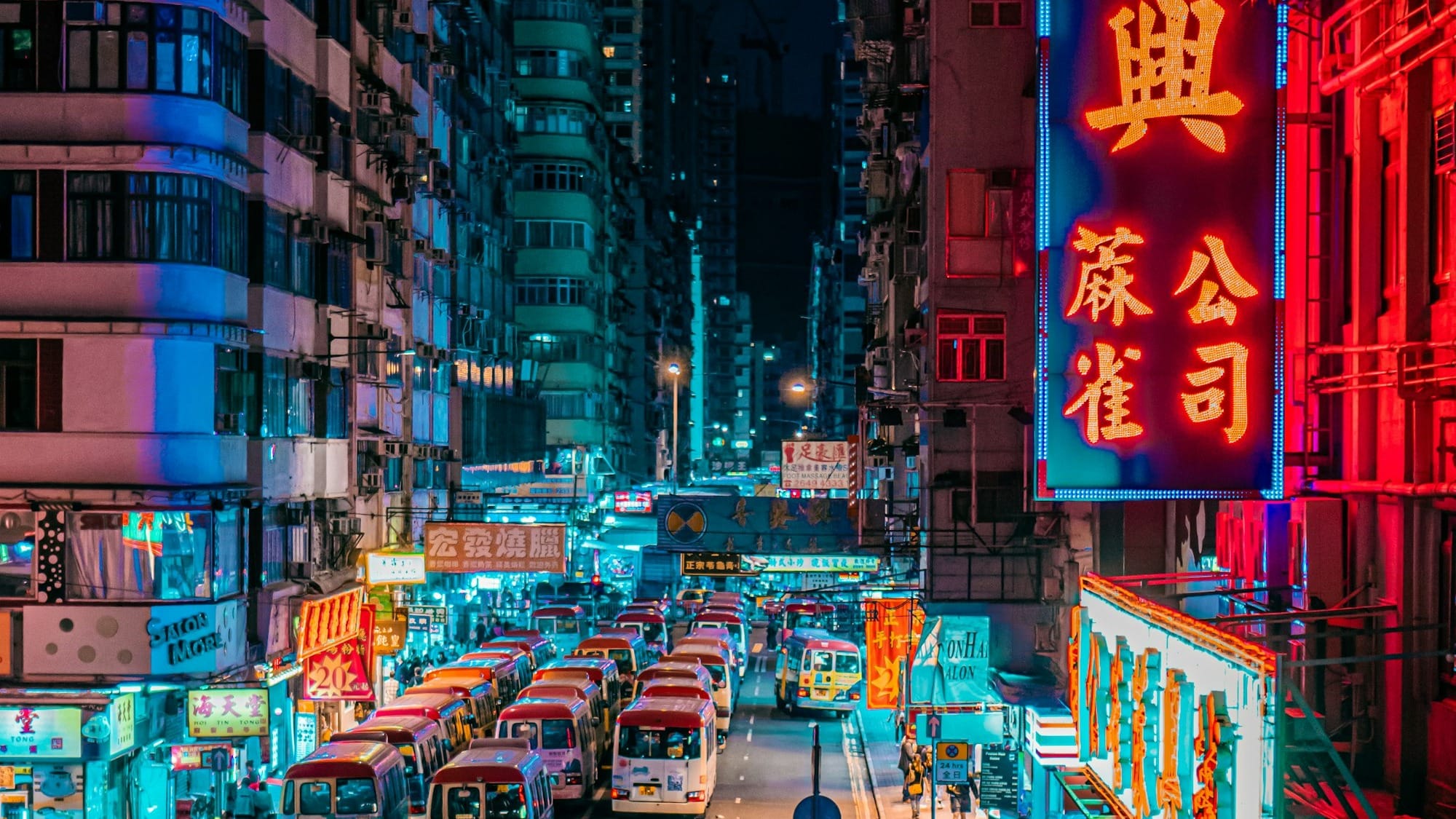 red bus on road during night time